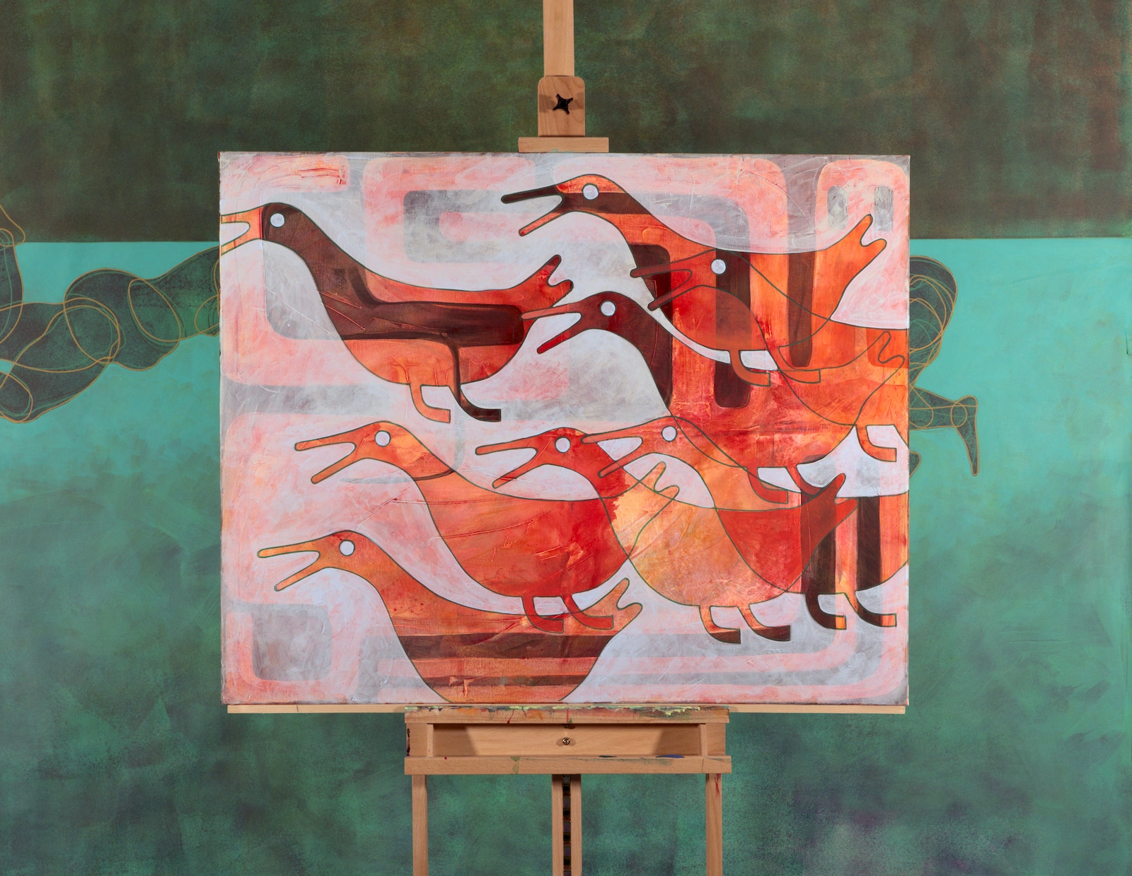 Painting showing the canvas 'Side Vision' on a wooden easel in the studio, against a large teal and green painted backdrop crossed by looping outlines.